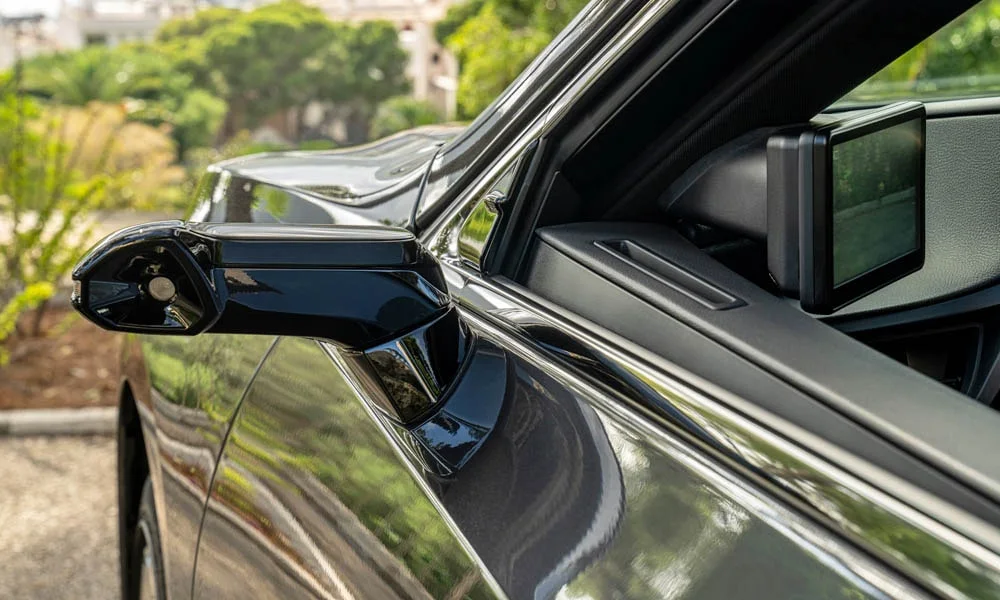 Фото Lexus ES 350 — наружное зеркало. Корпус зеркала в цвет кузова или контрастный чёрный — зависит от комплектации Lexus ES 350 — наружное зеркало