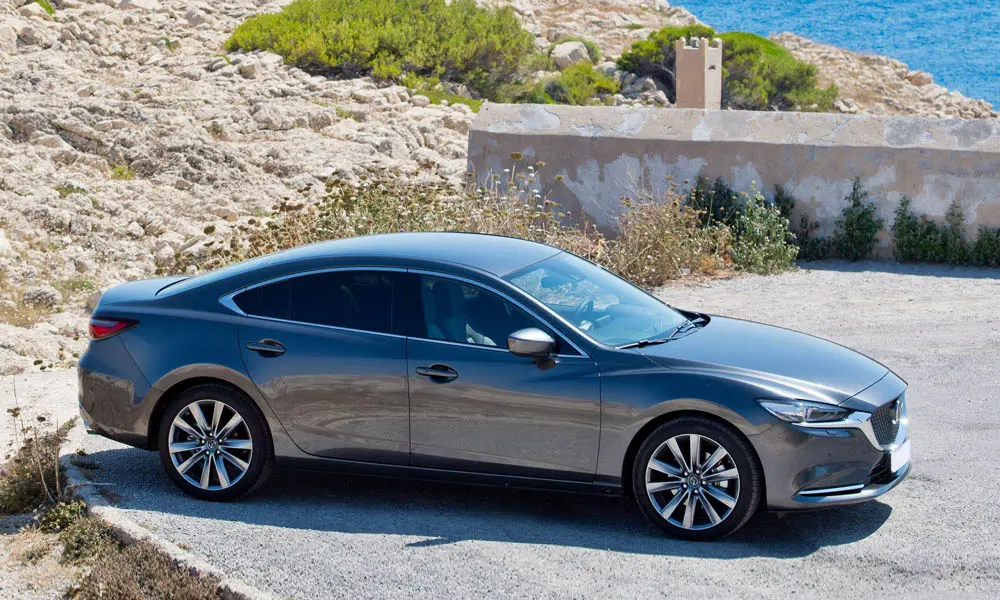 Фото Mazda 6 — вид сбоку. Профиль кузова: колёсная база, свесы и линия остекления Mazda 6 — вид сбоку